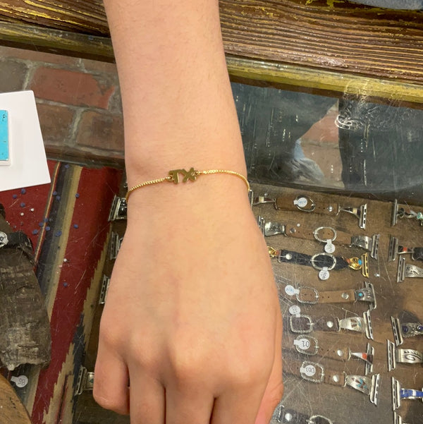 TX gold bracelet